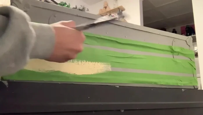 Remove the tape to reveal the lines. Repeat the taping and painting process for the second set of lines.