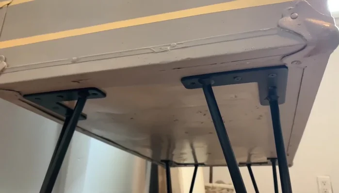 Attach the legs to the trunk using the added supports.