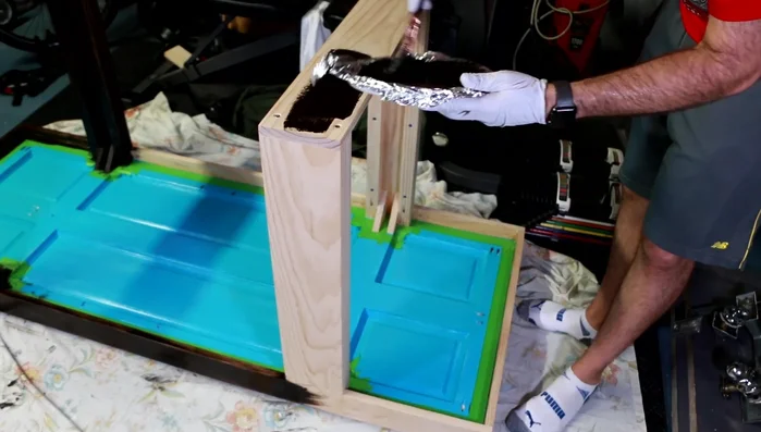 Tape off and stain inner panels and edges.