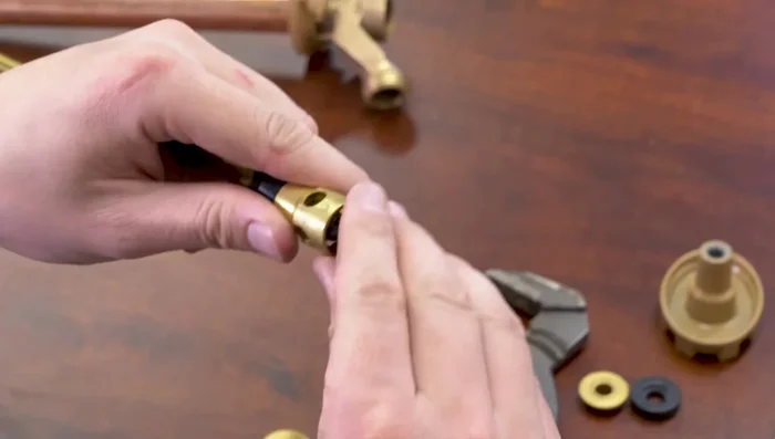 Remove the valve seat rubber and check valve rubber.