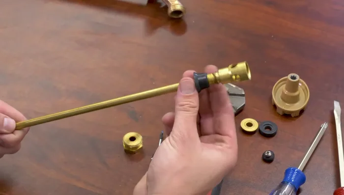 Reinstall the valve seat (flat side against the base). Re-tighten the screw.