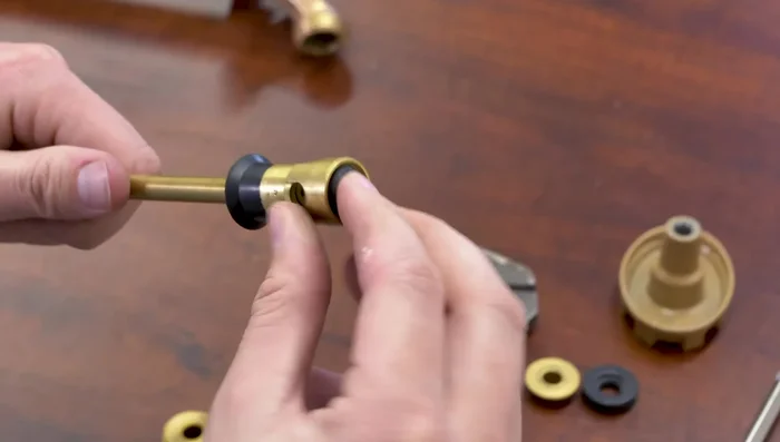 Reinstall the valve seat (flat side against the base). Re-tighten the screw.