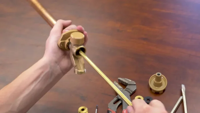 Reinstall the handle and tighten the screw.