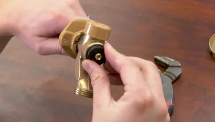 Reinstall the handle and tighten the screw.