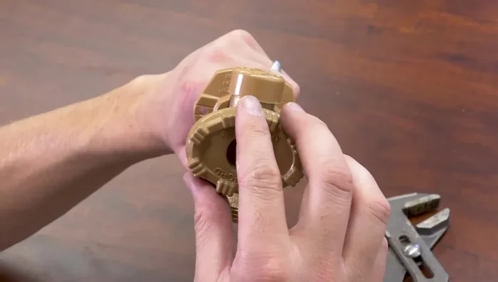 Reinstall the handle and tighten the screw.