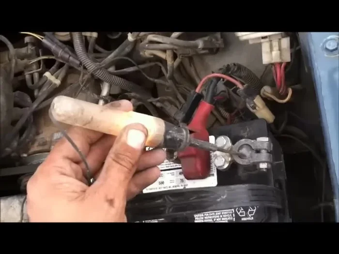 Touch the other end of the test light to the disconnected positive battery cable. If the light comes on, you have a short circuit.