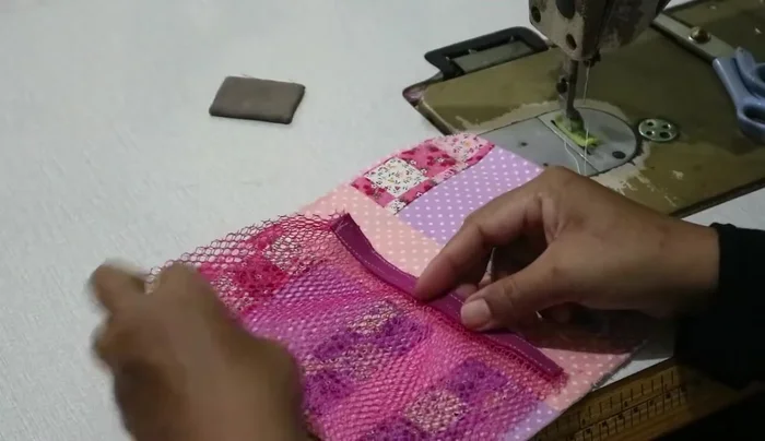 Sew the pockets to the divider.