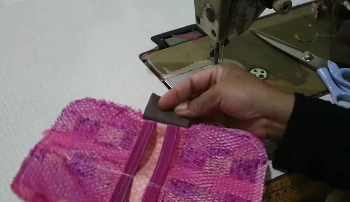 Sew the interior side parts, attaching the divider connector.