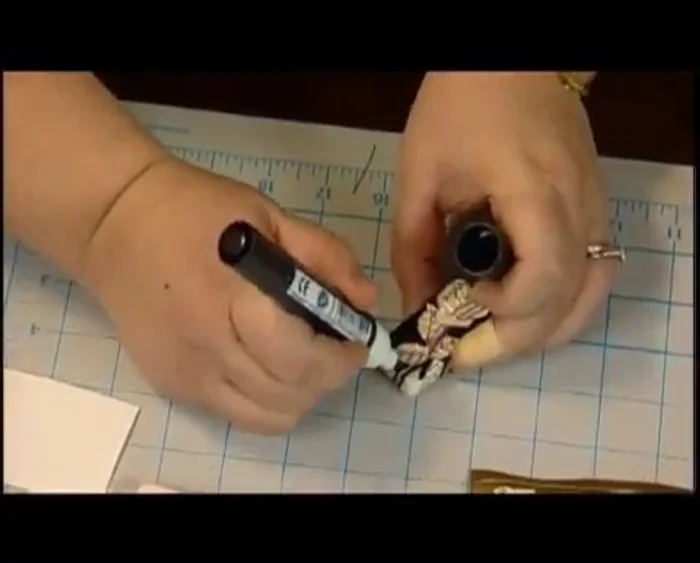 Use the broad-tipped paint pen to fill in the remaining areas. Make broad strokes, taking advantage of the pre-outlined shape.