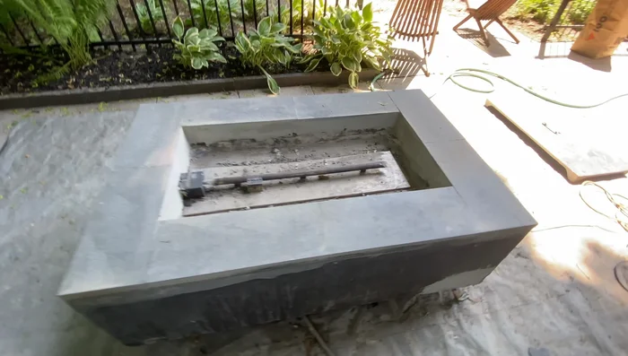 Paint the fire pit sides, lid, and interior with an outdoor/indoor paint suitable for high-heat areas. Apply multiple coats.