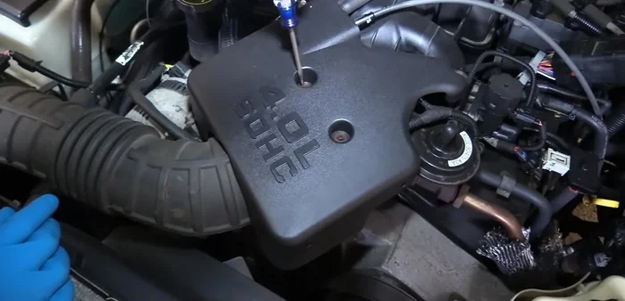 Remove the breather line from the back of the intake tube.