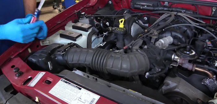 Remove the breather line from the back of the intake tube.