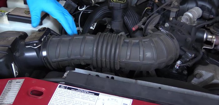 Remove the breather line from the back of the intake tube.