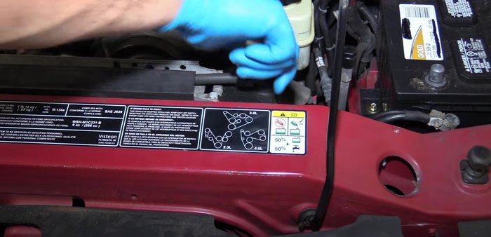 Drain the radiator coolant using the petcock on the passenger side.