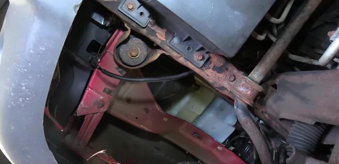 Drain the radiator coolant using the petcock on the passenger side.