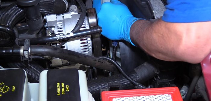 Install the remaining water pump pulley bolts.