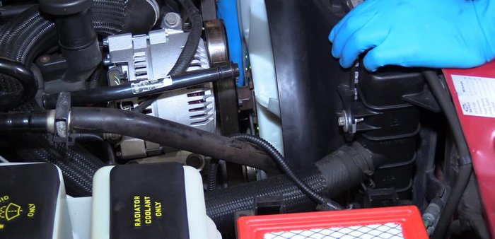 Install the remaining water pump pulley bolts.