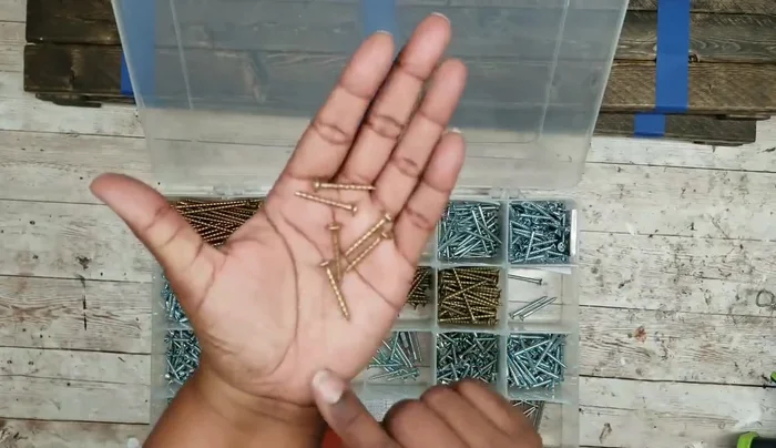 Attach shelves: Temporarily adhere the shelves to the sides using hot glue, aligning them with the tape markings. Drill pilot holes, remove the tape, and then permanently secure the shelves using 1 1/4" wood screws. Repeat this process for both sides of the shelf.