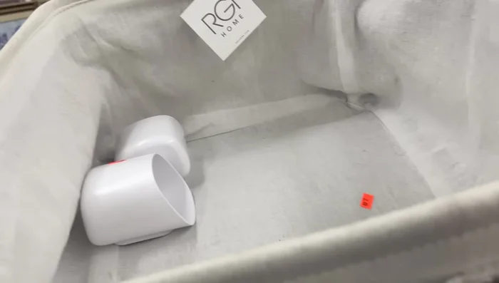 Utilizing Thrifted Storage: Source canvas baskets and towels in good condition. These items are significantly cheaper than similar retail options.