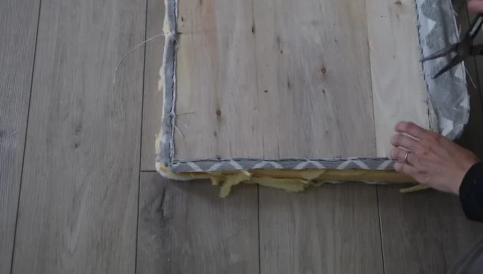 Repairing and assembling the ottoman: Install new wheels and address any structural damage (wood replacement, hole boring).