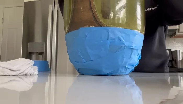 Assembling the lamp: Combine the prepared vase base with a suitable glass jar and light source (battery-operated or rechargeable). Add the lamp shade.