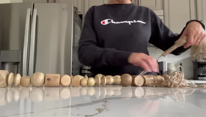 Adding decorative accents: Repurpose thrifted items such as beaded garlands, vases, and small decorative objects.