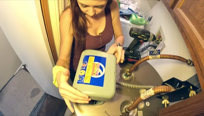 Remove the old water heater using a dolly.