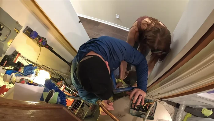 Remove the old water heater using a dolly.