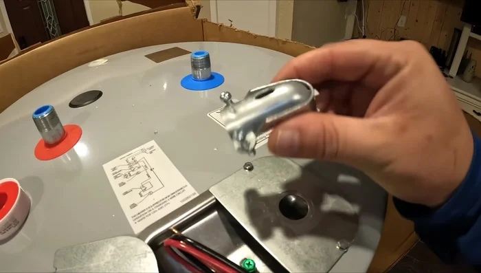 Install the new water heater. Apply Teflon tape to pipe threads (3 clockwise wraps). Use appropriate connectors for a clean connection.