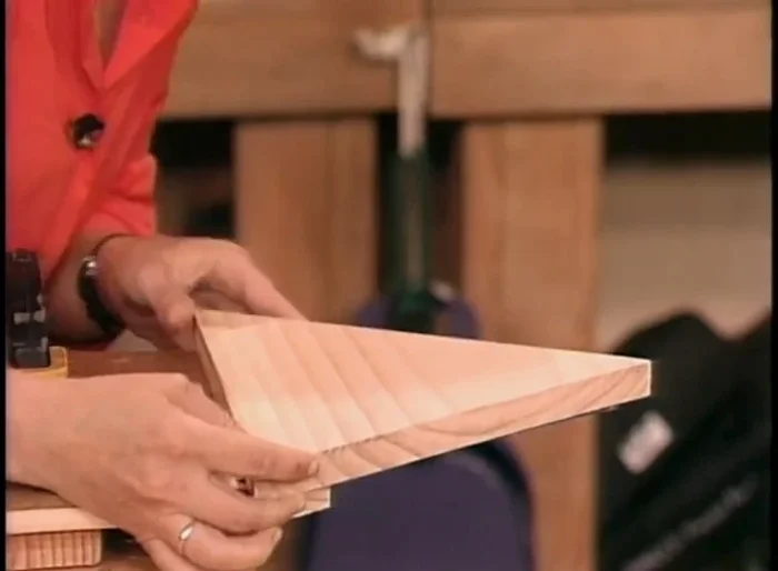 Glue the nose cone and base to the pegboard. Use clamps to hold everything in place while the glue dries.