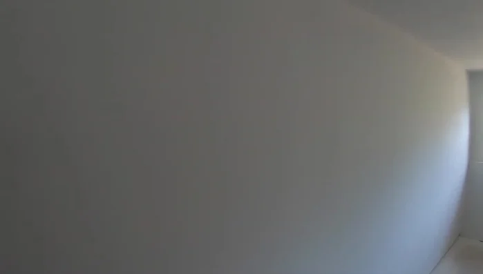 Sand the walls again with fine-grit sandpaper to achieve a super smooth finish.