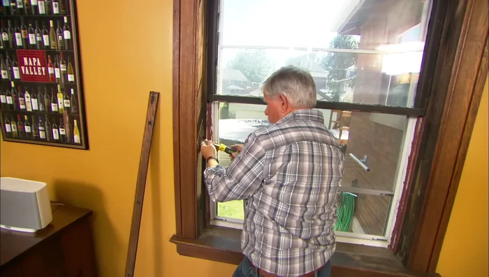 Remove access panel to reach the weights inside the wall cavity.