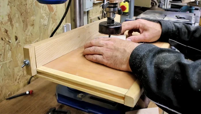 Shape the plywood pieces using a scroll saw (or file) and sand them down.