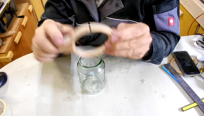 Glue and clamp the plywood top onto the jar.