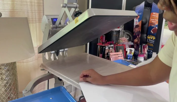 Heat press: Press the design onto the metal panel using a heat press at 400 degrees for 60 seconds. Use parchment paper to protect the heat press.