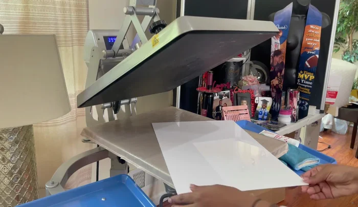 Heat press: Press the design onto the metal panel using a heat press at 400 degrees for 60 seconds. Use parchment paper to protect the heat press.