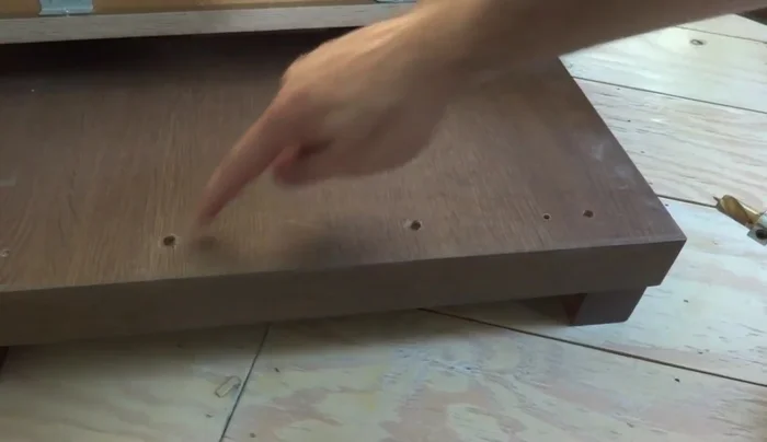 Drill holes for the pegs in the top piece. Insert and secure the pegs.