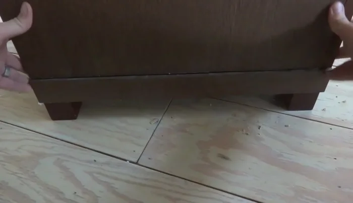 Drill holes for the pegs in the top piece. Insert and secure the pegs.