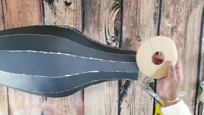 Cover the top and bottom with cardboard pieces and seal the gaps with hot glue.