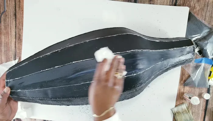 Seal the sand with a cloth and Mod Podge.