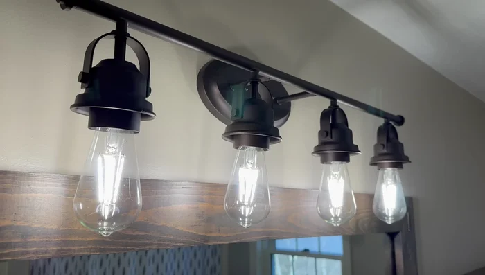 Install the new shower curtain and rings.