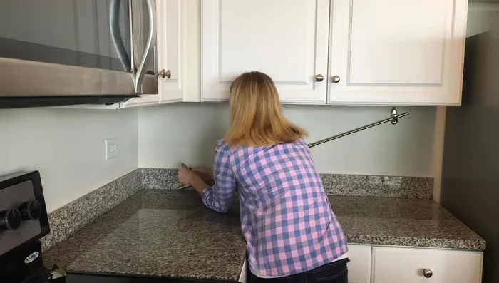 Create Under-Counter Storage with Curtain Rod and Command Hooks