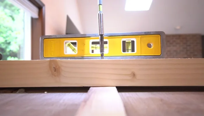 Install the horizontal base plate, ensuring it's perfectly straight using shims as needed.