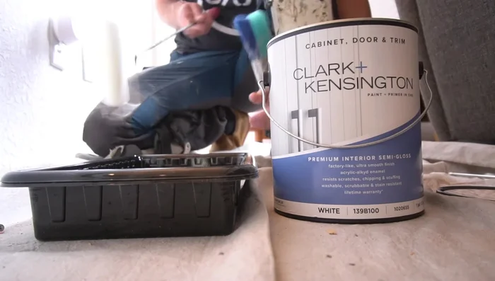 Paint the trim using a foam roller for a smooth, uniform finish. Apply a second coat if necessary.