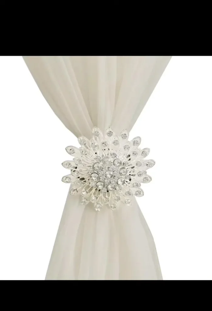 Contemporary Choice: Sleek geometric metal curtain tiebacks offer a minimalist yet functional solution.