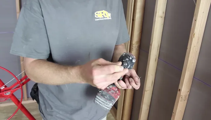 Space screws about an inch from the edges of the drywall to prevent tear-out and ensure a clean joint.