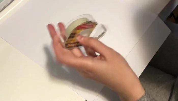 Cut strips of black cardstock and use double-sided tape to create a border around the white background.