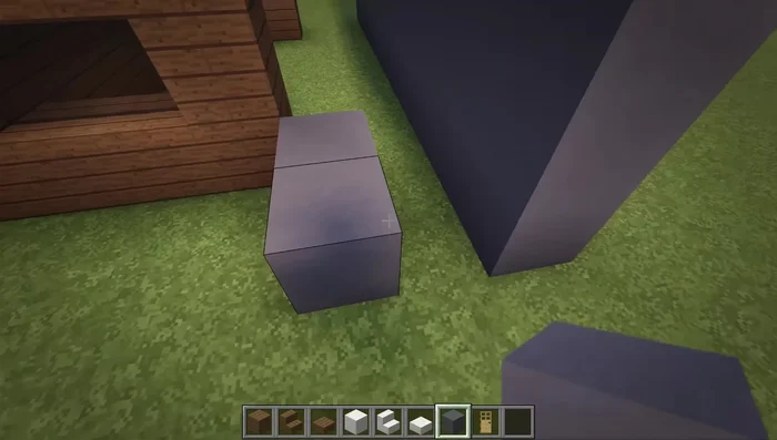 Add a layer of cyan clay along the top row of the walls and black stained glass panes in the gaps between the walls.