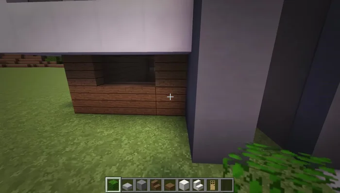 Add bushes (leaves) around the left side of the building.