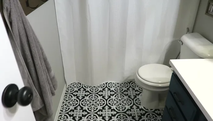 Install black shower rod.